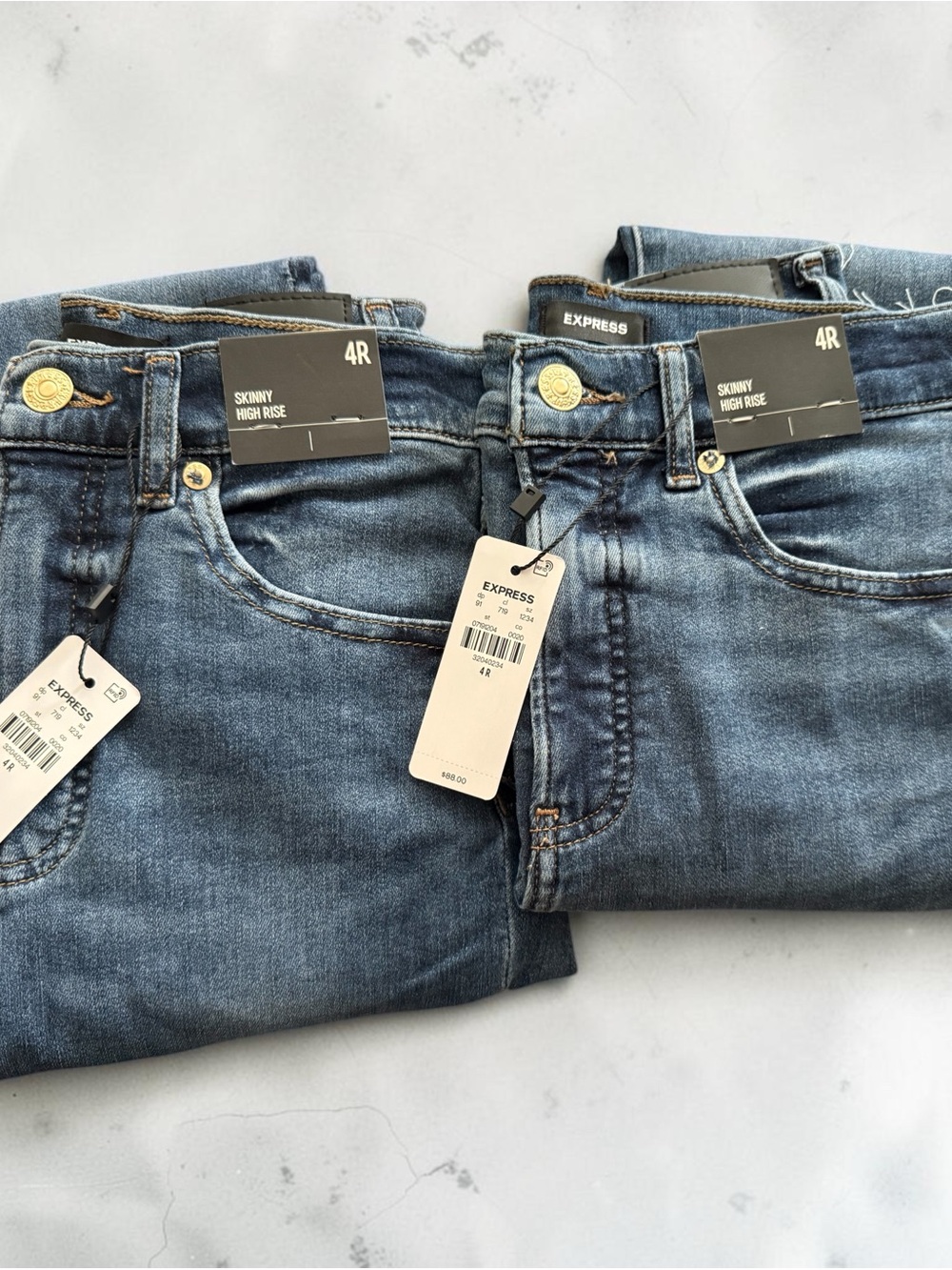 2 pairs of size 4 Express Women's Skinny High Rise Jeans — Medium Blue Wash